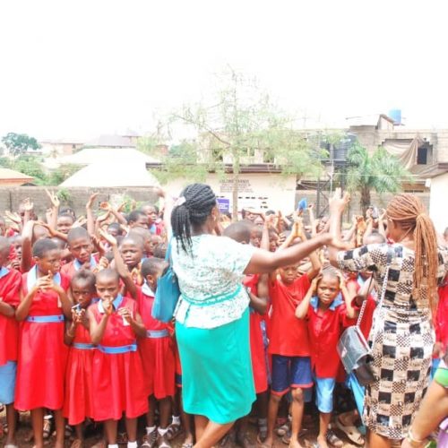 Students Cheering out of joy at the inauguration ceremony of the toilet project in Enugu, Nigeria